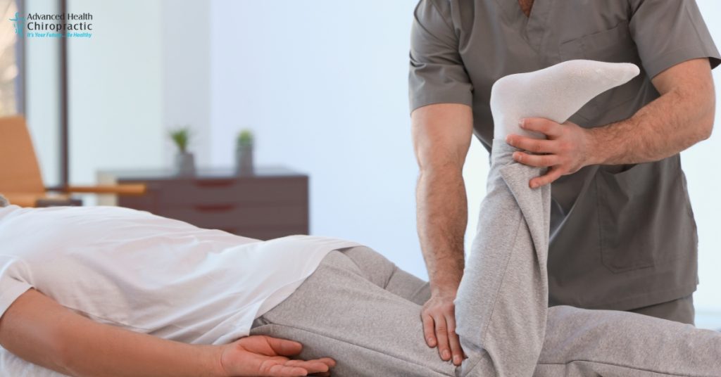 Chiropractor adjusting patient with arthritis in Troy, MI