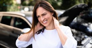 Woman experiencing neck pain after a car accident